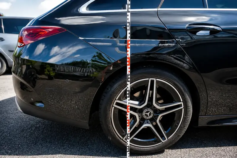 Messlatte am Hinterrad eines schwarzen Mercedes, um den Schaden maßstabsgetreu zu dokumentieren